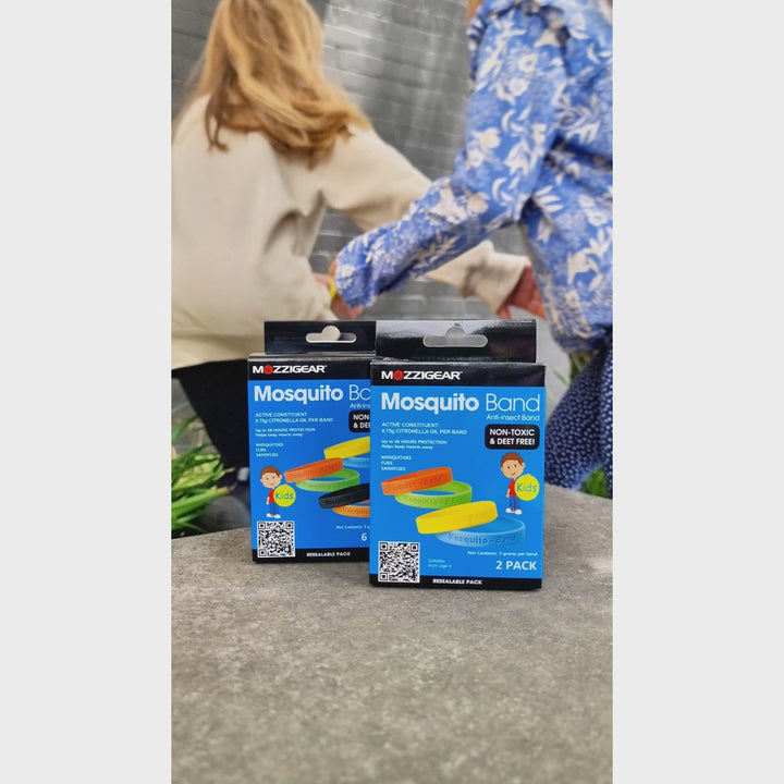 Unboxing video of Mozzigear Mosquito Bands for kids. Children open the packaging to reveal waterproof, silicon wristbands infused with citronella. The DEET-free bands provide up to 48 hours of safe, natural protection against mosquitoes and insects